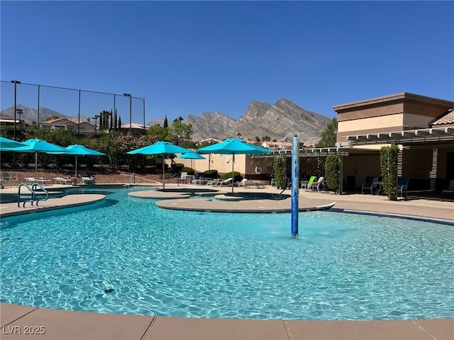 view of swimming pool featuring a mountain view and a patio area