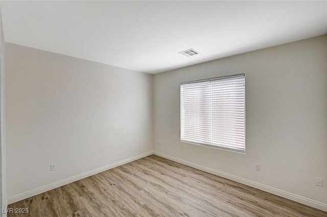 unfurnished room featuring light hardwood / wood-style flooring