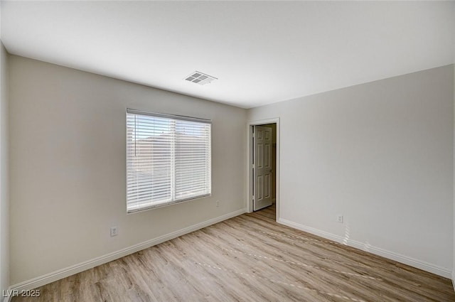 empty room featuring light hardwood / wood-style floors