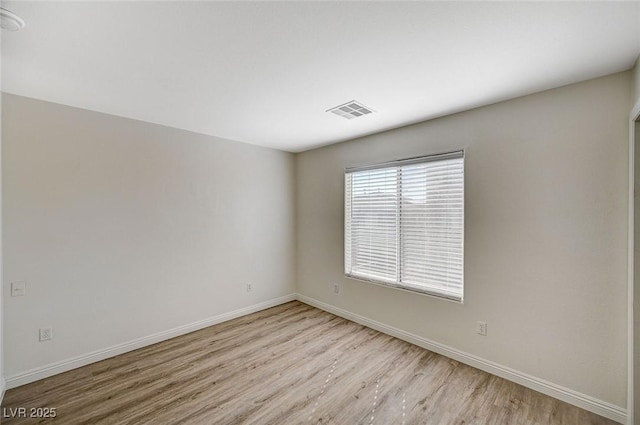 empty room with light wood-type flooring