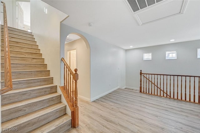 stairway with hardwood / wood-style floors