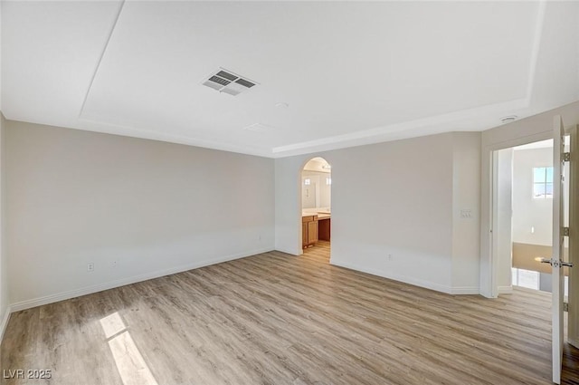 spare room with light wood-type flooring