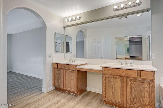 bathroom with vanity and hardwood / wood-style floors