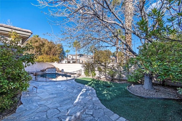 exterior space with a patio area and a fenced backyard