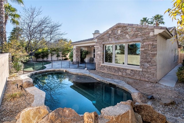 view of swimming pool with a fenced in pool and a fenced backyard