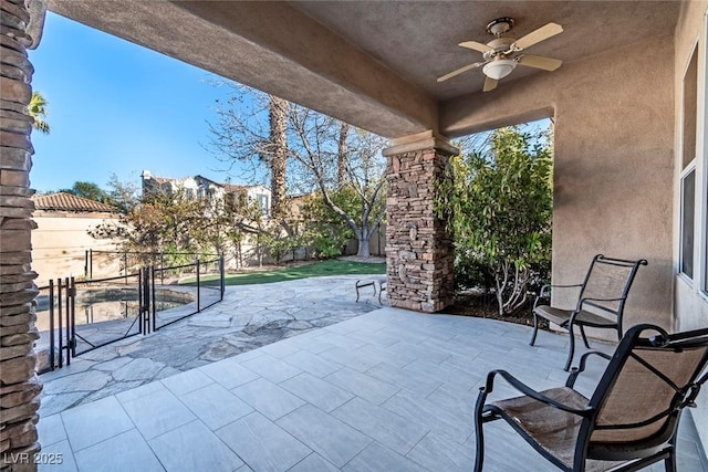 view of patio / terrace featuring a fenced backyard and a ceiling fan