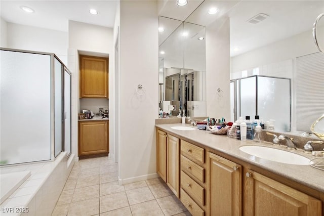 bathroom with a stall shower, visible vents, a sink, and double vanity