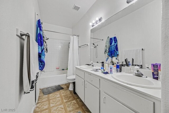 full bathroom featuring vanity, parquet flooring, toilet, and shower / bath combo