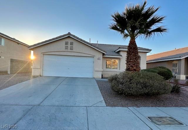 ranch-style home with a garage