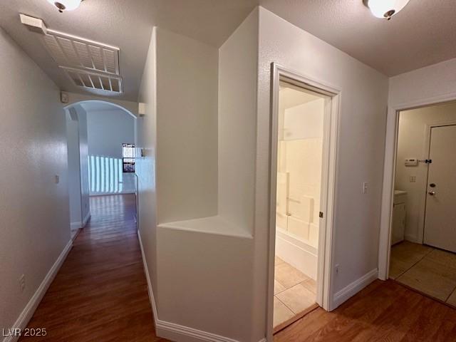 hallway featuring hardwood / wood-style floors