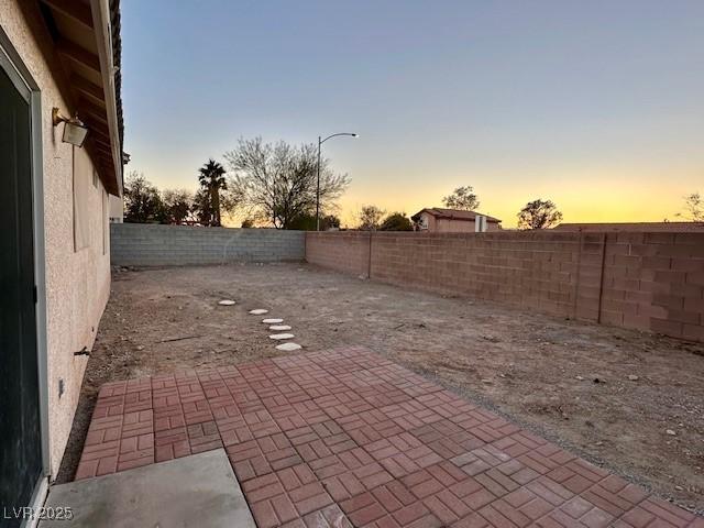 view of patio terrace at dusk