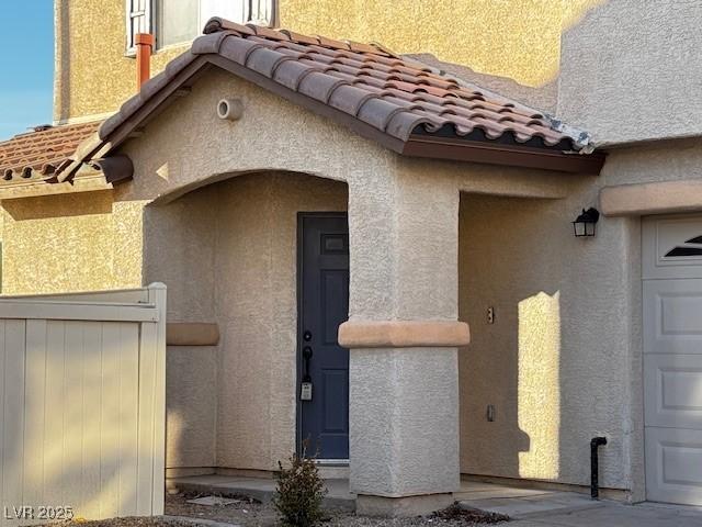 entrance to property featuring a garage