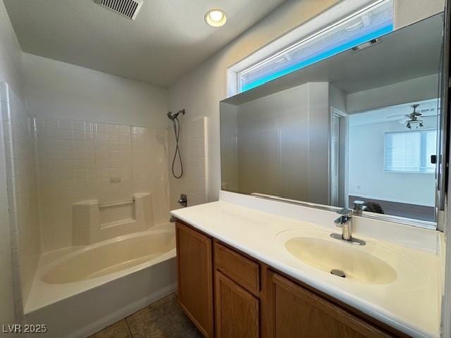 bathroom featuring shower / bathtub combination, tile patterned floors, vanity, and plenty of natural light