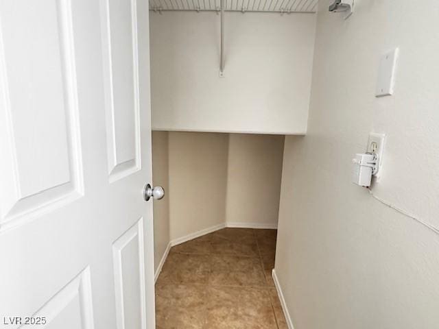 spacious closet with light tile patterned flooring