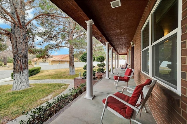 view of patio featuring a porch