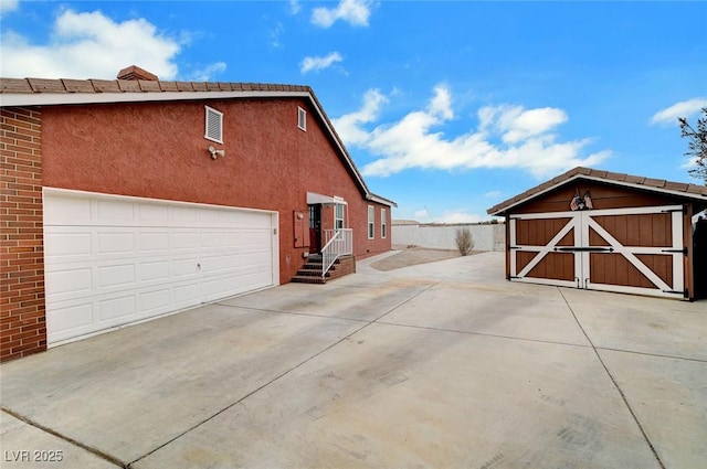 view of property exterior featuring a garage