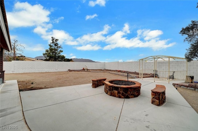 view of patio / terrace featuring an outdoor fire pit