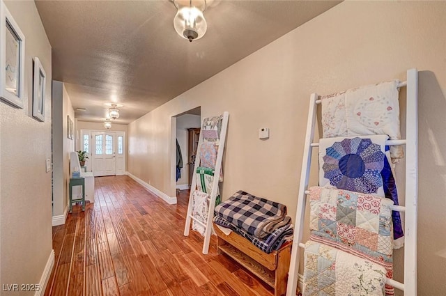 hall with wood-type flooring