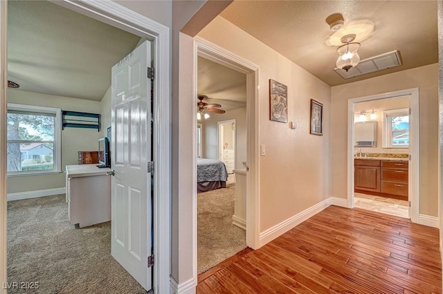 hall with light wood-type flooring