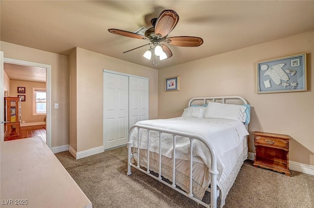 bedroom with carpet floors, ceiling fan, and a closet