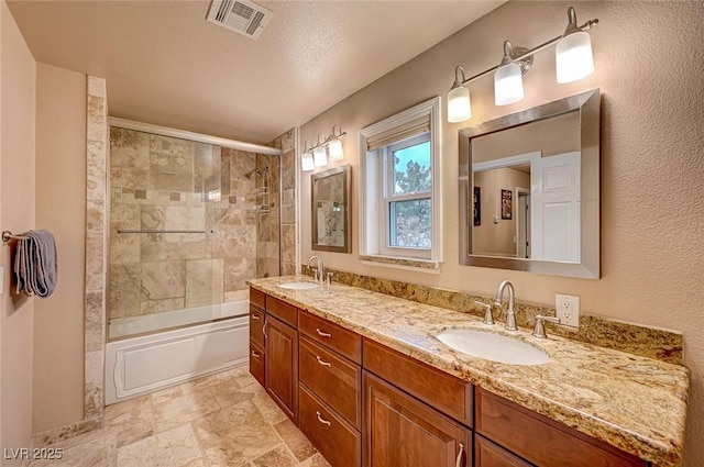 bathroom featuring vanity and combined bath / shower with glass door