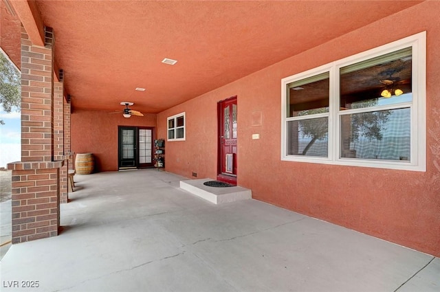 view of patio / terrace featuring ceiling fan