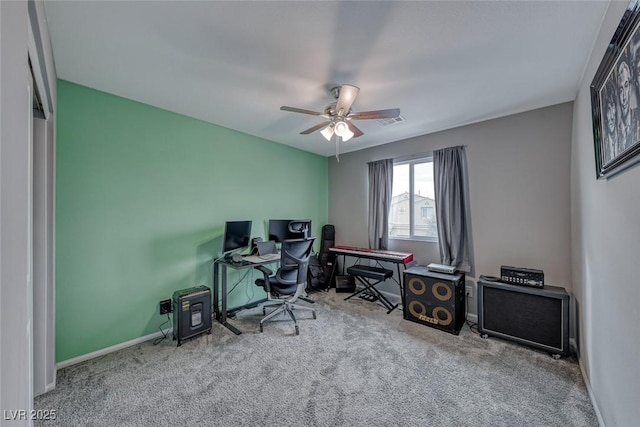 office space with ceiling fan and light carpet