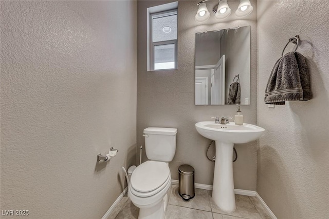 bathroom featuring tile patterned floors and toilet