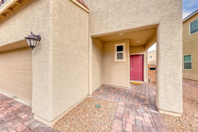 property entrance featuring a garage