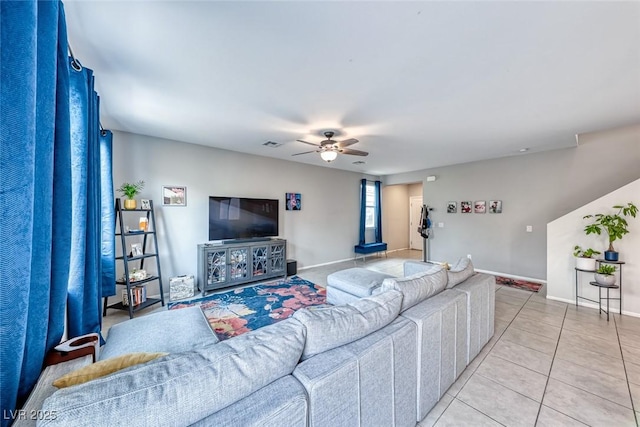 tiled living room featuring ceiling fan