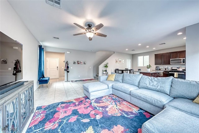 tiled living room with ceiling fan