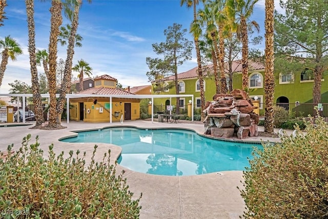 view of swimming pool with a patio