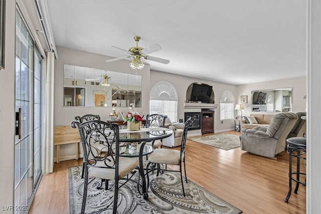 dining area featuring hardwood / wood-style flooring and ceiling fan