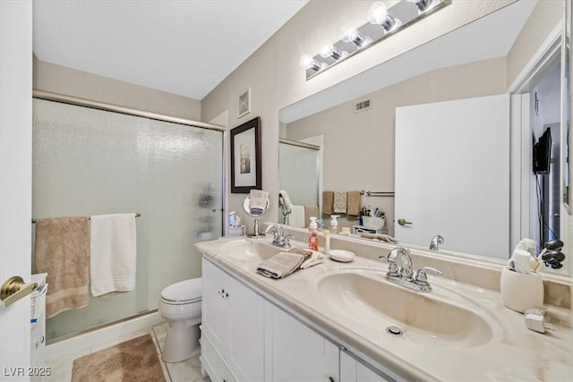 bathroom featuring an enclosed shower, vanity, tile patterned floors, and toilet