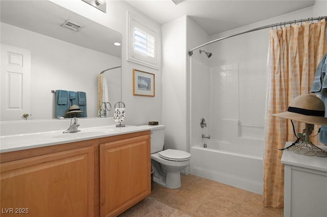 full bathroom featuring vanity, tile patterned floors, toilet, and shower / bath combo