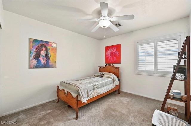 bedroom with ceiling fan and light colored carpet