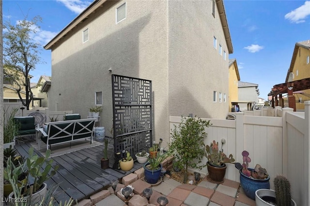 rear view of property with a patio and an outdoor hangout area