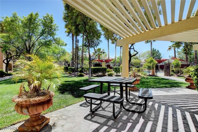 view of patio / terrace with outdoor dining area, fence, and a pergola