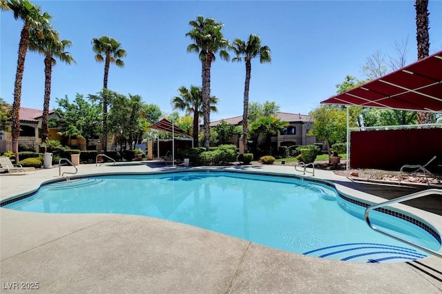 pool featuring a patio and fence