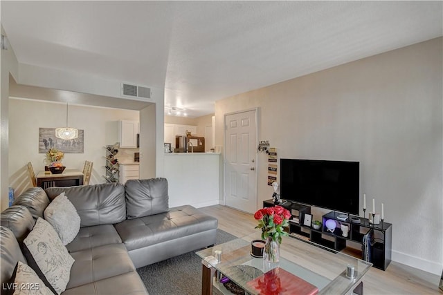 living room with light hardwood / wood-style floors