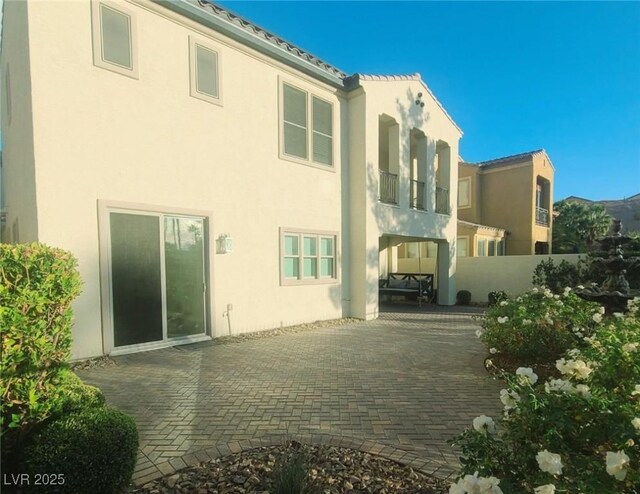 rear view of house featuring a patio