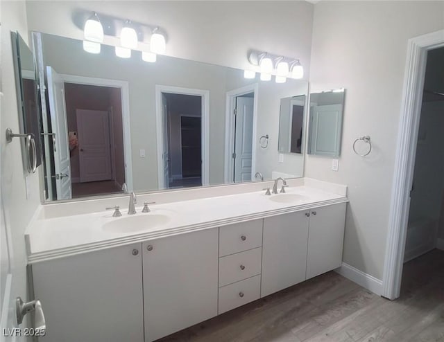 bathroom featuring vanity and hardwood / wood-style flooring