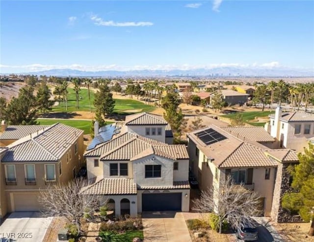 drone / aerial view featuring a mountain view and a residential view