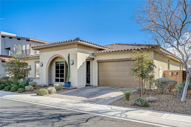 mediterranean / spanish-style home with a garage