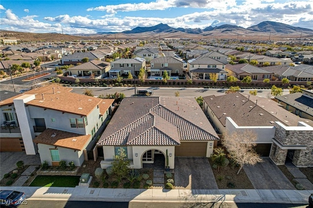 birds eye view of property featuring a mountain view