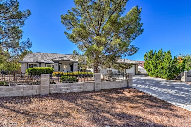 ranch-style home featuring a garage