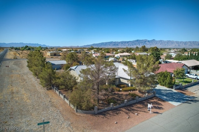 birds eye view of property featuring a mountain view