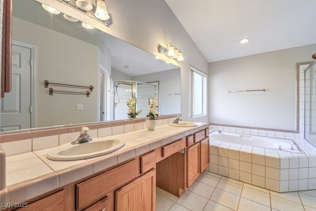 bathroom with tile patterned flooring, vaulted ceiling, vanity, and plus walk in shower