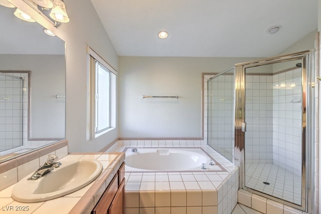 bathroom featuring vanity and plus walk in shower