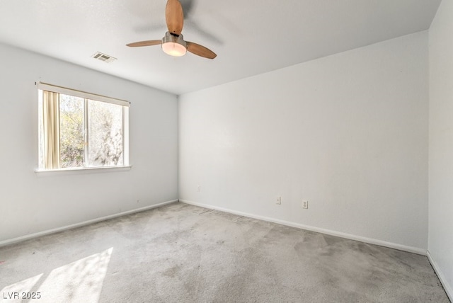 empty room featuring light carpet and ceiling fan